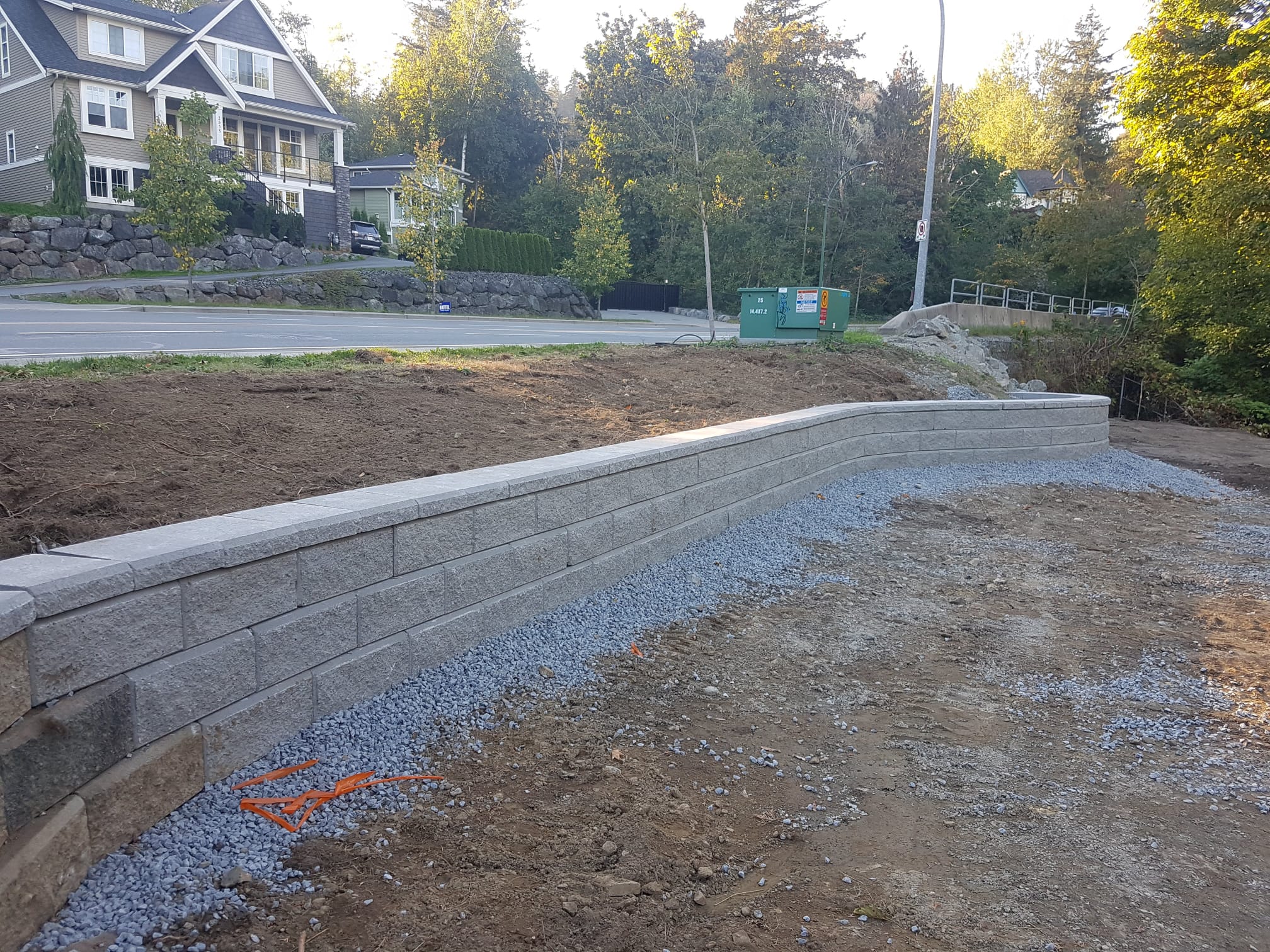 Curved block retaining wall built by DKA Landscaping